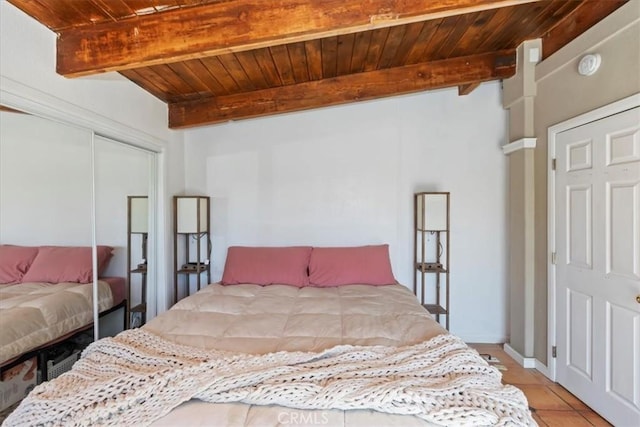 1946 Desert Front Rd, Wrightwood, CA 92397 - bedroom featuring a wooden ceiling with exposed beams, light tile patterned flooring, and a closet