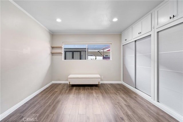 800 N Eucalyptus Ave Unit 108, Inglewood, CA 90302 - unfurnished bedroom with wood finished floors, ornamental molding, recessed lighting, and a closet