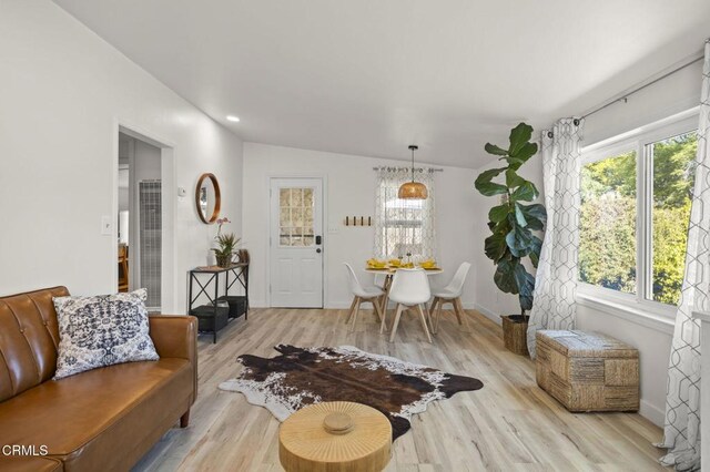 12710 Ojai Rd, Ojai, CA 93023 - living area featuring light wood-style flooring, lofted ceiling, and a heating unit