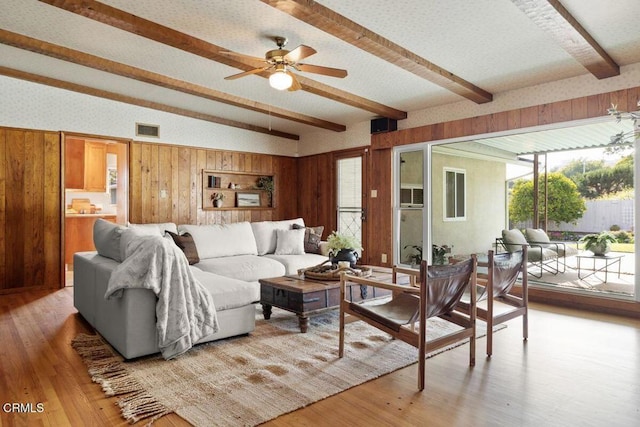410 Palomares Ave, Ventura, CA 93003 - living area with beam ceiling, wood walls, light wood-type flooring, and ceiling fan