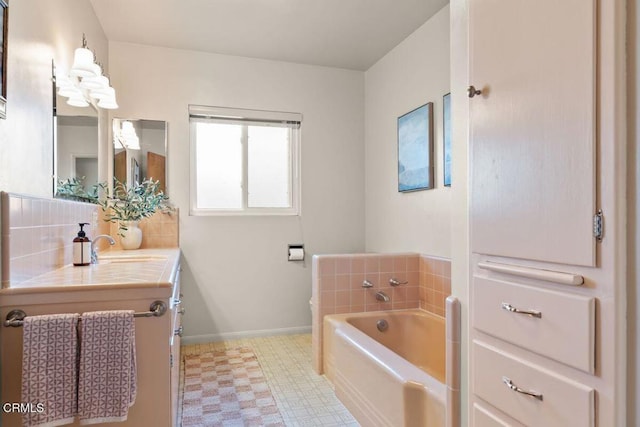 410 Palomares Ave, Ventura, CA 93003 - full bath featuring tile patterned floors, a bath, vanity, and tasteful backsplash
