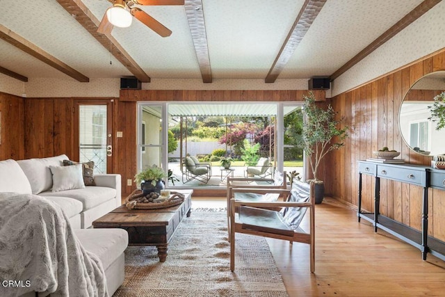 410 Palomares Ave, Ventura, CA 93003 - living area with wood walls, beam ceiling, light wood finished floors, and ceiling fan