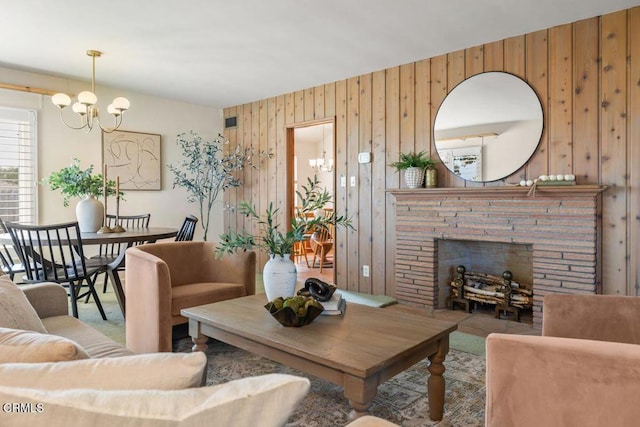 410 Palomares Ave, Ventura, CA 93003 - carpeted living room featuring a brick fireplace, wooden walls, and a chandelier