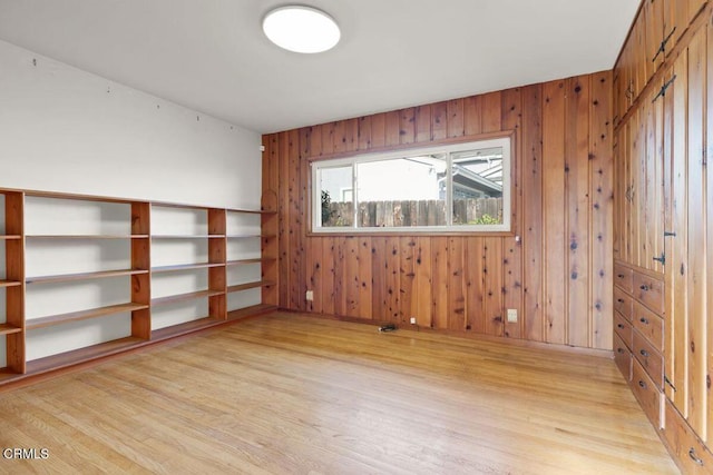 410 Palomares Ave, Ventura, CA 93003 - unfurnished room featuring light wood-type flooring and wooden walls