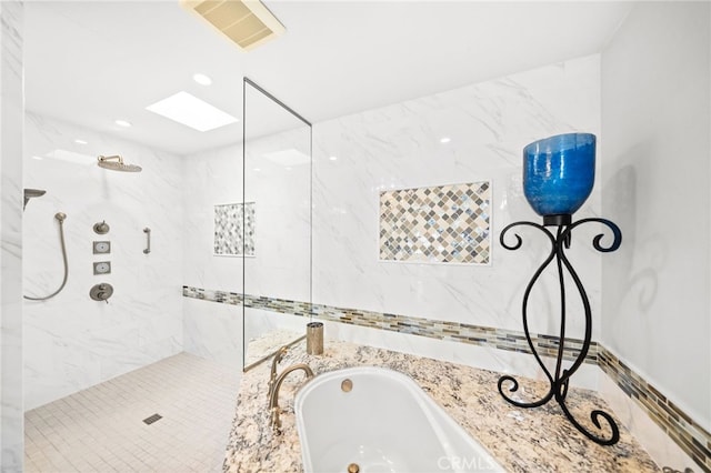 40115 Via Cordova, Temecula, CA 92592 - bathroom featuring tiled shower, a garden tub, and a skylight