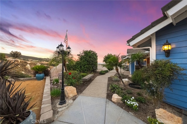 40115 Via Cordova, Temecula, CA 92592 - yard at dusk with a patio area