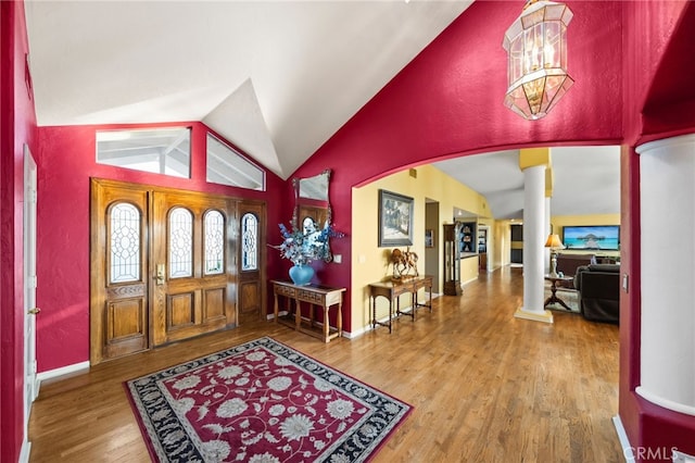 40115 Via Cordova, Temecula, CA 92592 - foyer entrance featuring ornate columns, vaulted ceiling, wood finished floors, and arched walkways