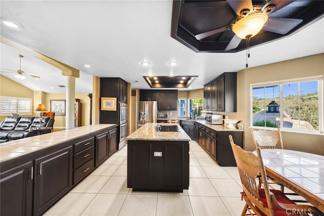 40115 Via Cordova, Temecula, CA 92592 - kitchen with ceiling fan, appliances with stainless steel finishes, a kitchen island, plenty of natural light, and recessed lighting