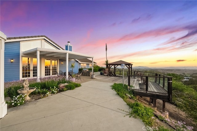 40115 Via Cordova, Temecula, CA 92592 - view of home's exterior with a gazebo, french doors, and a chimney