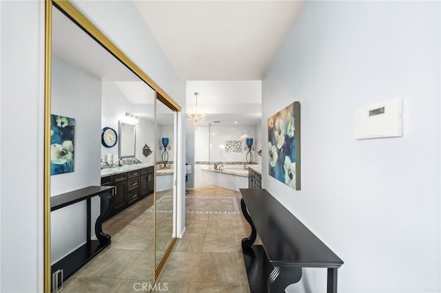 40115 Via Cordova, Temecula, CA 92592 - corridor featuring a chandelier and light tile patterned floors