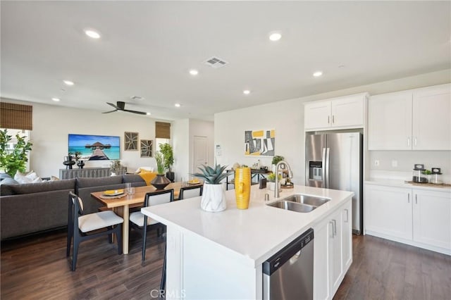 14180 Astra St, Moreno Valley, CA 92555 - kitchen featuring stainless steel appliances, open floor plan, light countertops, dark wood finished floors, and recessed lighting