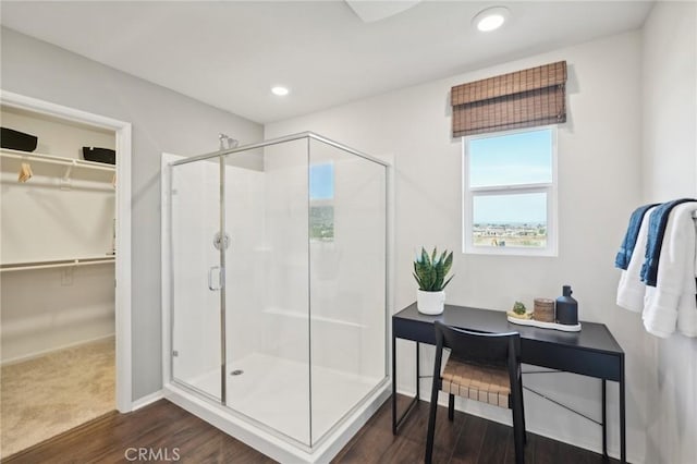 14180 Astra St, Moreno Valley, CA 92555 - full bath featuring a shower stall, wood finished floors, a spacious closet, and recessed lighting