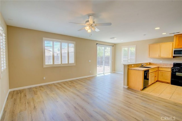 518 Barclay Way, Merced, CA 95348 - kitchen with black appliances, a peninsula, light wood-type flooring, open floor plan, and recessed lighting