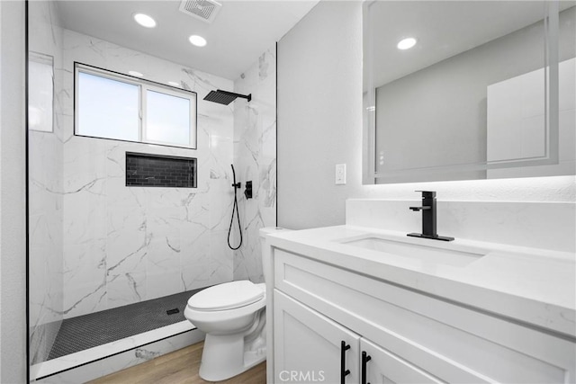837 S Magnolia Ave, Anaheim, CA 92804 - bathroom with vanity, a marble finish shower, wood finished floors, and recessed lighting