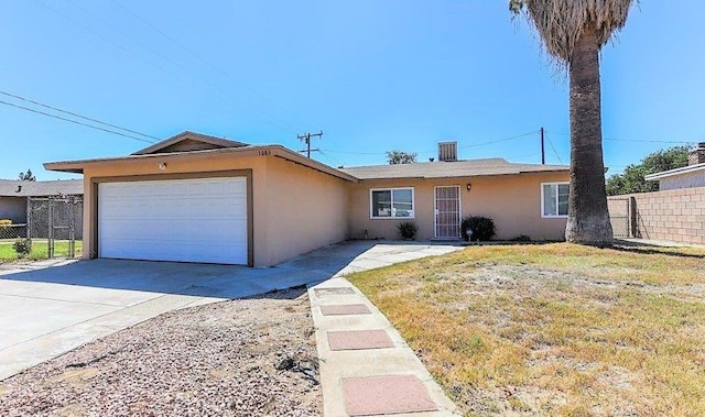 1083 Lorraine Pl, Rialto, CA 92376 - ranch-style house with stucco siding, an attached garage, and concrete driveway