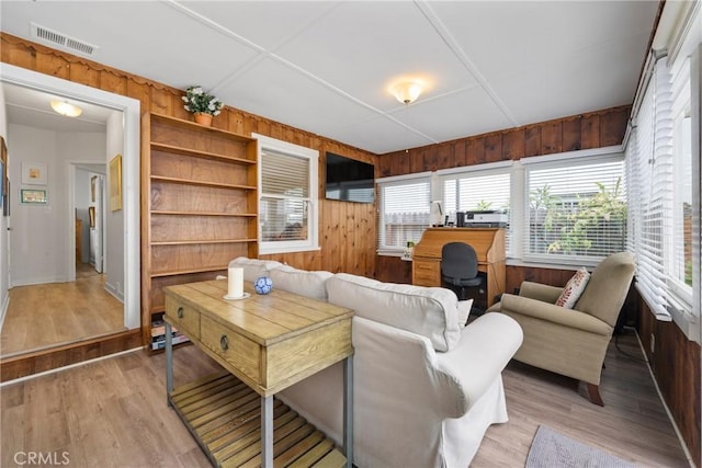 302 Sapphire Ave, Newport Beach, CA 92662 - living room with wood walls and light wood-style flooring