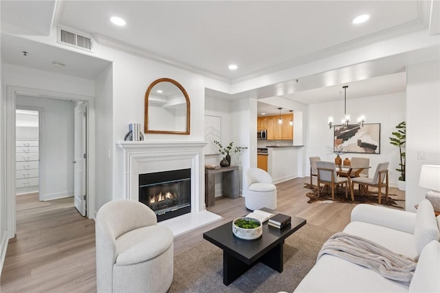 1800 Alma Ave Unit 106, Walnut Creek, CA 94596 - living area featuring light wood-style floors, a glass covered fireplace, a chandelier, and recessed lighting
