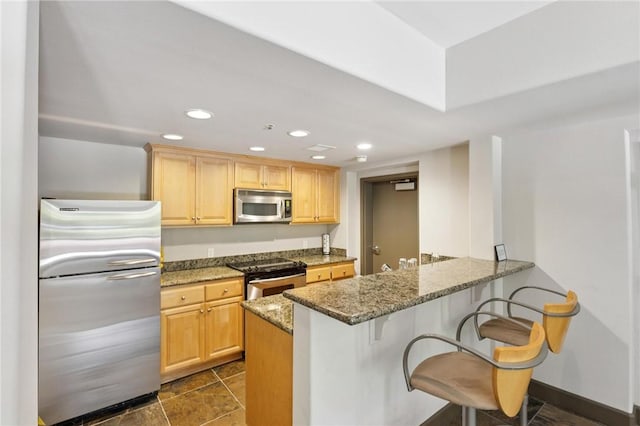 1800 Alma Ave Unit 106, Walnut Creek, CA 94596 - kitchen featuring stainless steel appliances, a breakfast bar, light stone counters, recessed lighting, and light brown cabinets