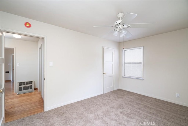 2124 Rutgers Ave, Long Beach, CA 90815 - unfurnished room featuring ceiling fan, light carpet, and heating unit