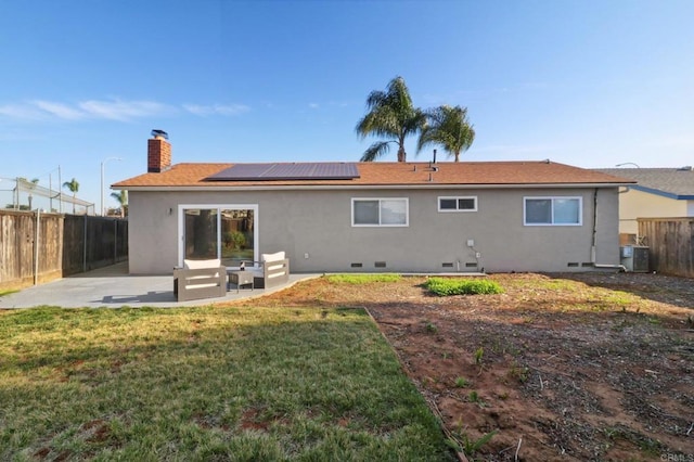 1204 E El Norte Pkwy, Escondido, CA 92027 - back of property featuring a chimney, roof mounted solar panels, a fenced backyard, stucco siding, and crawl space