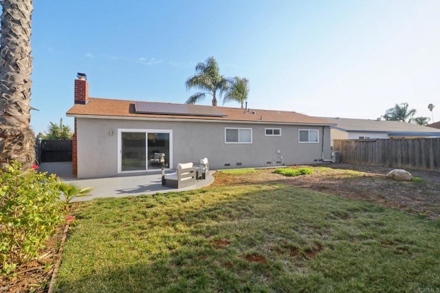 1204 E El Norte Pkwy, Escondido, CA 92027 - rear view of house with a chimney, stucco siding, a patio, roof mounted solar panels, and a fenced backyard