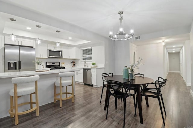 1204 E El Norte Pkwy, Escondido, CA 92027 - dining room with recessed lighting, wood finished floors, a raised ceiling, and a chandelier