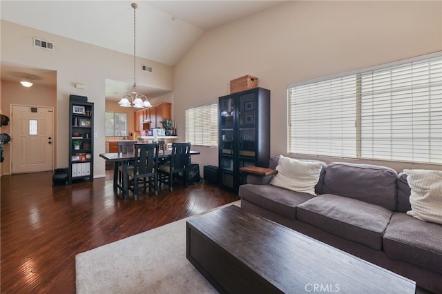 251 E Center St, Covina, CA 91723 - living area with dark wood-type flooring, a chandelier, and vaulted ceiling