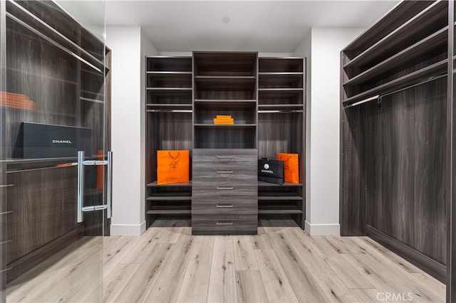 61 Dorado, Irvine, CA 92618 - walk in closet featuring wood finished floors