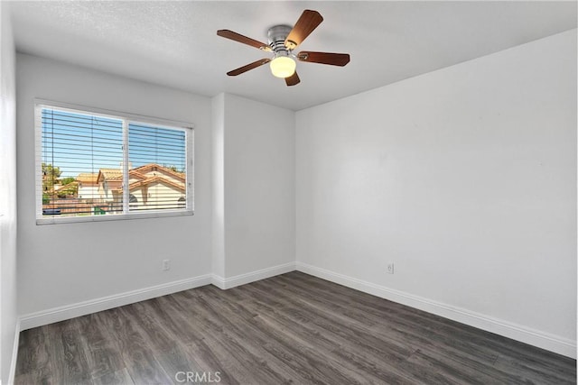 12725 Sundown Rd, Victorville, CA 92392 - spare room featuring dark wood-type flooring and a ceiling fan