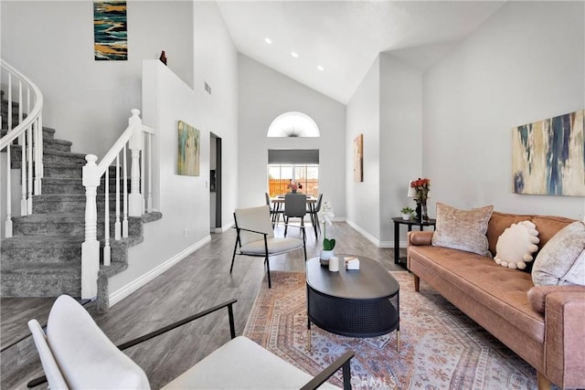 12725 Sundown Rd, Victorville, CA 92392 - living area featuring wood finished floors, stairway, high vaulted ceiling, and recessed lighting
