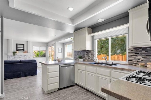 12725 Sundown Rd, Victorville, CA 92392 - kitchen with dishwasher, a peninsula, open floor plan, healthy amount of natural light, and recessed lighting