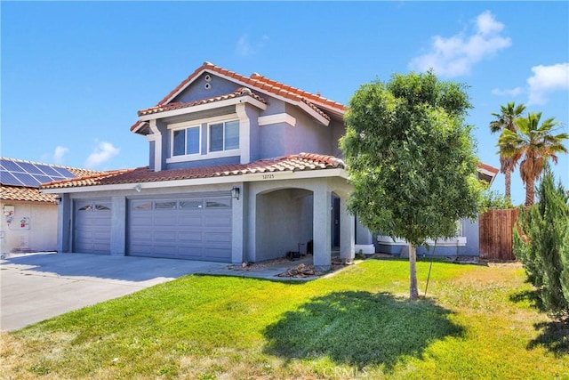 12725 Sundown Rd, Victorville, CA 92392 - mediterranean / spanish-style home with stucco siding, driveway, a tile roof, and a garage