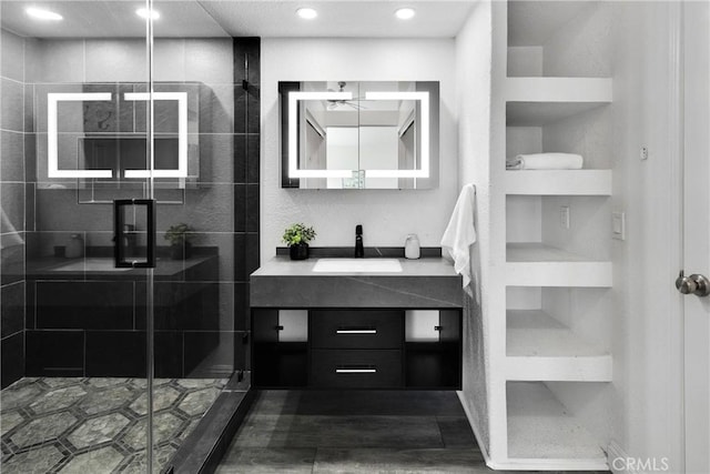 12725 Sundown Rd, Victorville, CA 92392 - bathroom with vanity, a shower stall, and recessed lighting