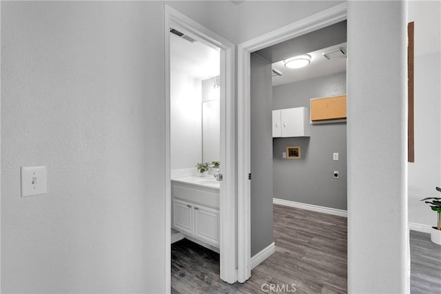 12725 Sundown Rd, Victorville, CA 92392 - bathroom featuring vanity and wood finished floors