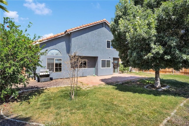 12725 Sundown Rd, Victorville, CA 92392 - view of property exterior featuring a tile roof, stucco siding, and a patio