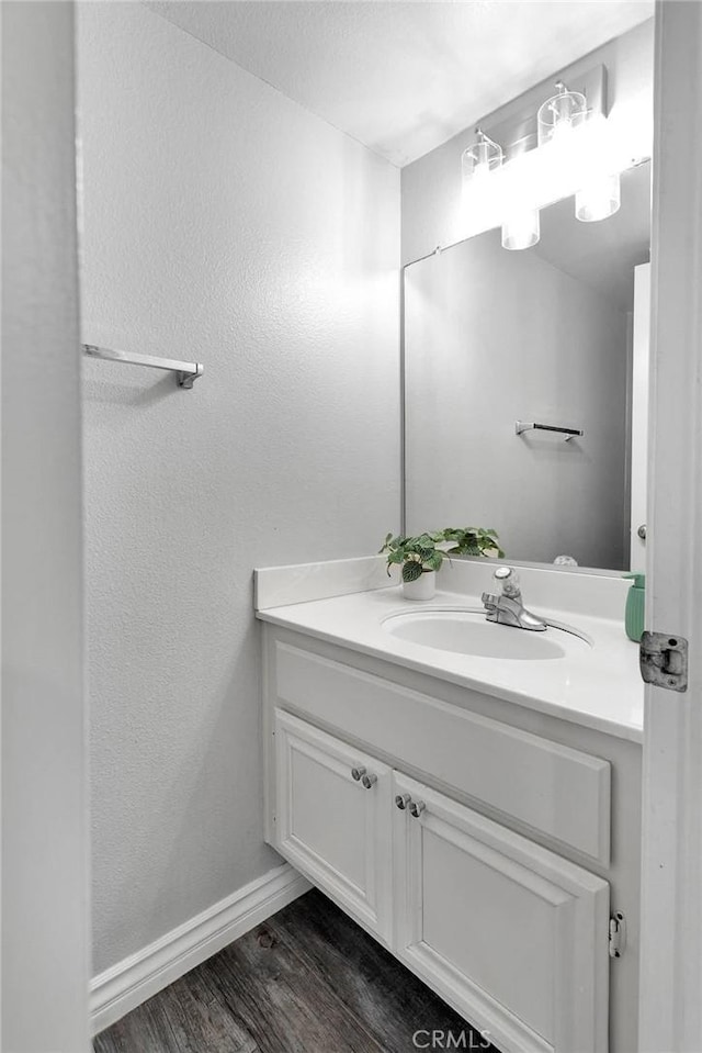 12725 Sundown Rd, Victorville, CA 92392 - bathroom with vanity and wood finished floors