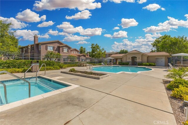 39903 Millbrook Way Unit 7C, Murrieta, CA 92563 - community pool featuring a patio and a hot tub