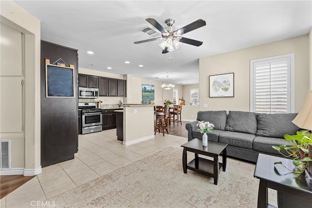 39903 Millbrook Way Unit 7C, Murrieta, CA 92563 - living area featuring ceiling fan, light tile patterned floors, a chandelier, and recessed lighting