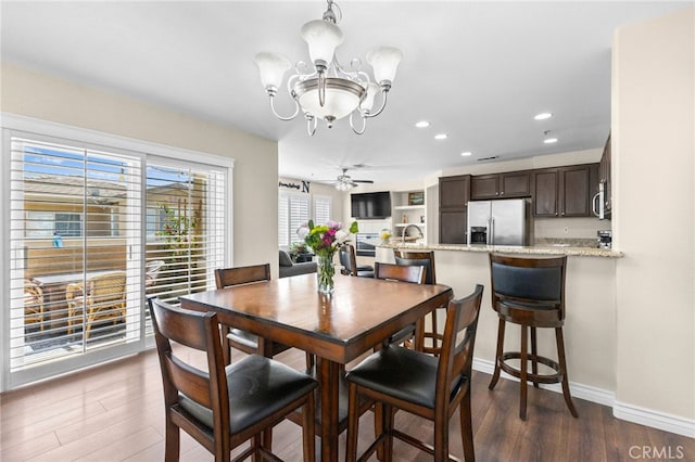 39903 Millbrook Way Unit 7C, Murrieta, CA 92563 - dining room with a chandelier, dark wood-style flooring, and recessed lighting
