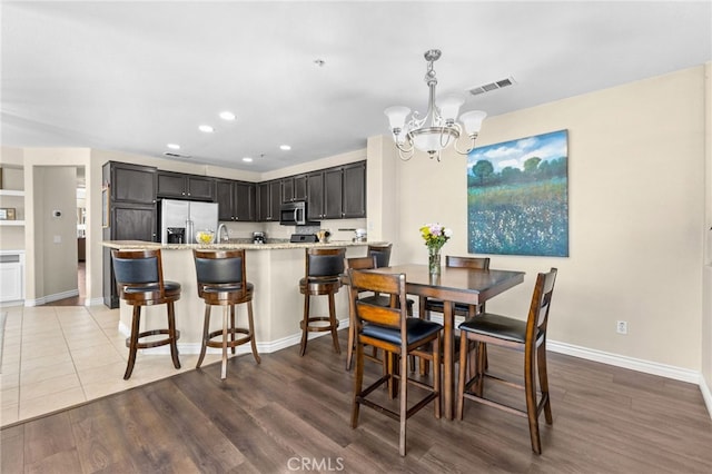 39903 Millbrook Way Unit 7C, Murrieta, CA 92563 - dining room featuring a chandelier, recessed lighting, and wood finished floors