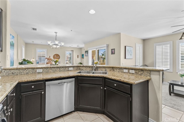 39903 Millbrook Way Unit 7C, Murrieta, CA 92563 - kitchen featuring stainless steel dishwasher, light tile patterned floors, a chandelier, light stone counters, and a peninsula