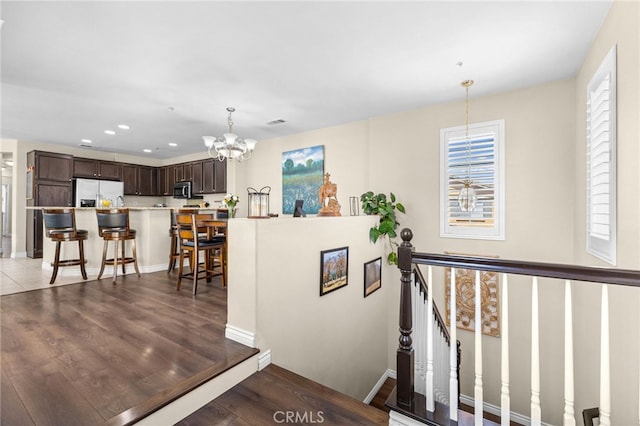 39903 Millbrook Way Unit 7C, Murrieta, CA 92563 - corridor featuring an upstairs landing, a chandelier, recessed lighting, and wood finished floors