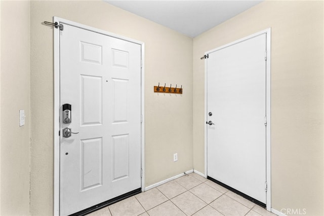 39903 Millbrook Way Unit 7C, Murrieta, CA 92563 - foyer with light tile patterned floors and baseboards