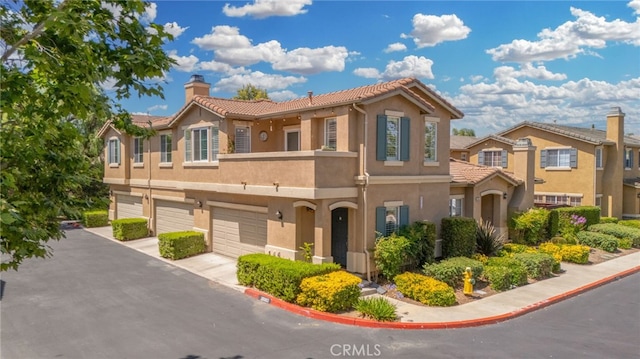 39903 Millbrook Way Unit 7C, Murrieta, CA 92563 - view of front of property featuring stucco siding, a tile roof, and a garage