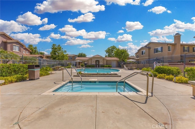 39903 Millbrook Way Unit 7C, Murrieta, CA 92563 - community pool featuring a hot tub, a residential view, and a patio area