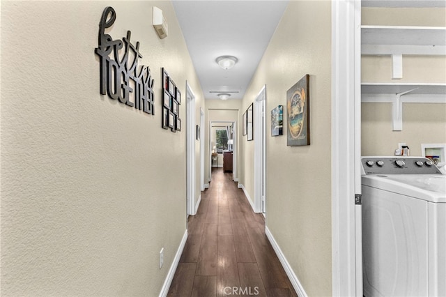 39903 Millbrook Way Unit 7C, Murrieta, CA 92563 - corridor with washer / clothes dryer, dark wood finished floors, and a textured wall