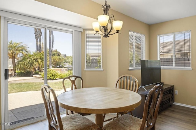 2085 Koala Pl, Oxnard, CA 93036 - dining area with a chandelier and wood finished floors