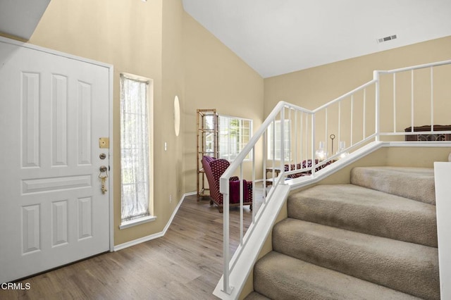 2085 Koala Pl, Oxnard, CA 93036 - foyer entrance with wood finished floors, high vaulted ceiling, and stairs
