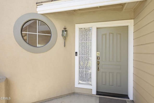 2085 Koala Pl, Oxnard, CA 93036 - doorway to property featuring stucco siding