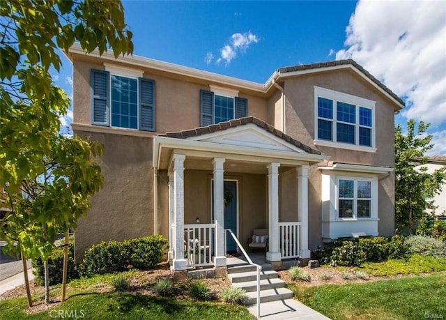 28251 N Via Sonata Dr, Valencia, CA 91354 - view of front facade with stucco siding and covered porch